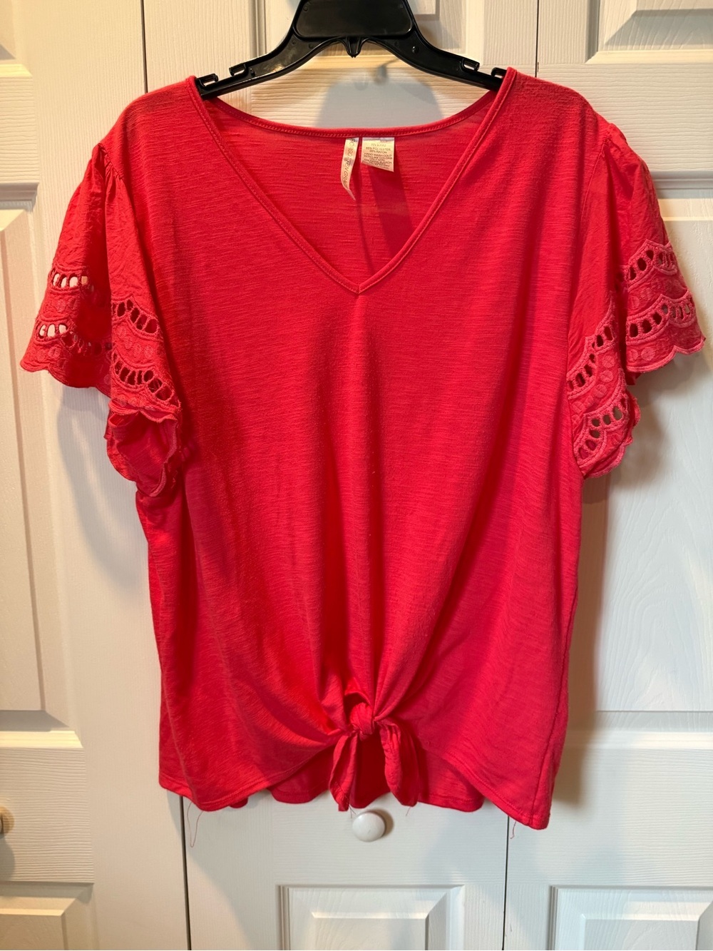 # V-Neck 1X Tie Front Tee with Eyelet Flutter Sleeves